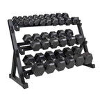 Black hexagonal dumbbells on a metal rack on a white background