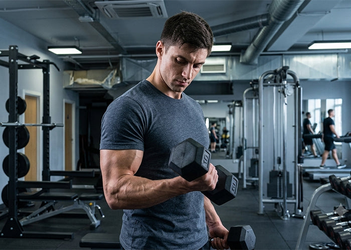 Man with lift hex dumbbells sets