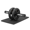 Black ab roller on a black mat with white background