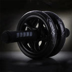 Black exercise wheel on a dark background