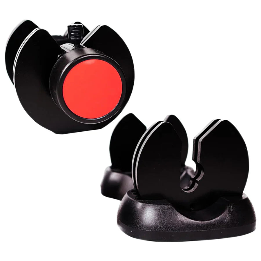 Black and red fishing reel with a stand on a white background