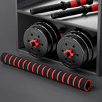 Black and red dumbbells on a gray surface with a dark background