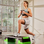 Woman exercising with dumbbells on a step platform in a home setting