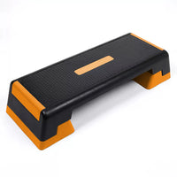 Step platform with black and orange design on a white background