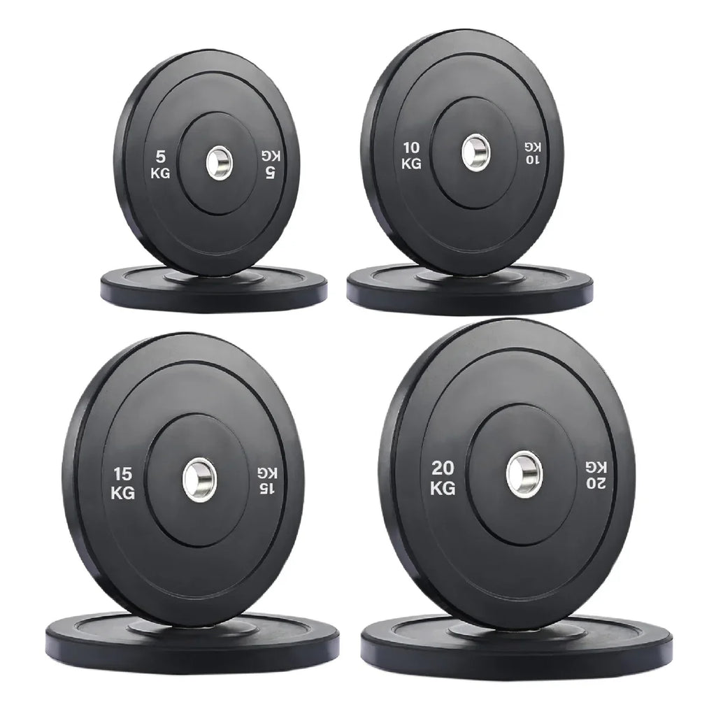 Set of four black weight plates with labeled weights on a white background