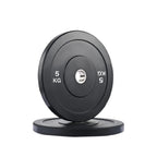 Pair of black weight plates with '5 KG' marking on a white background