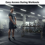 Man holding a kettlebell with a rack of kettlebells in a gym setting