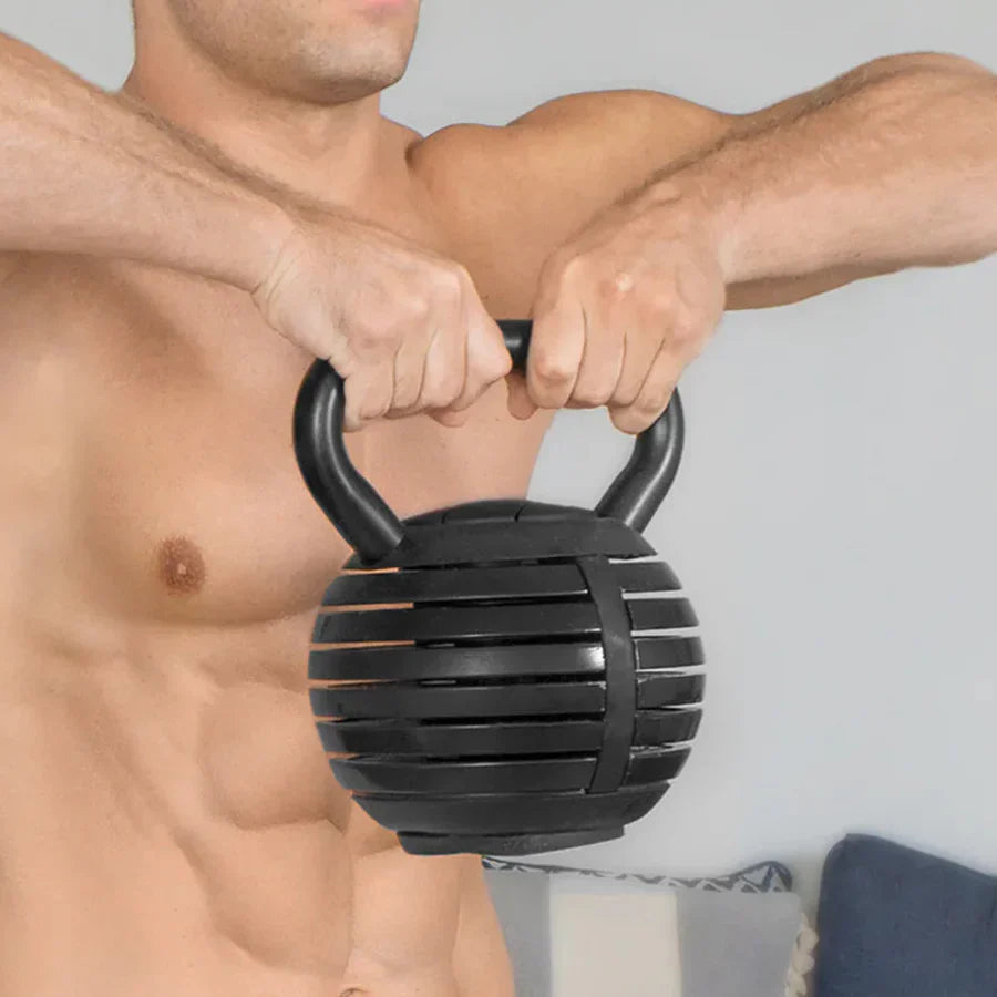 Man holding a black textured kettlebell against a neutral background