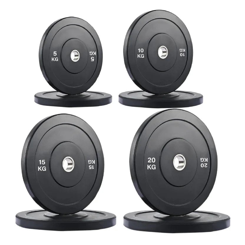 Set of four black weight plates with labeled weights on a white background
