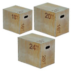Three wooden exercise boxes with height markings on a white background