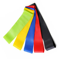 Set of colorful resistance bands on a white background
