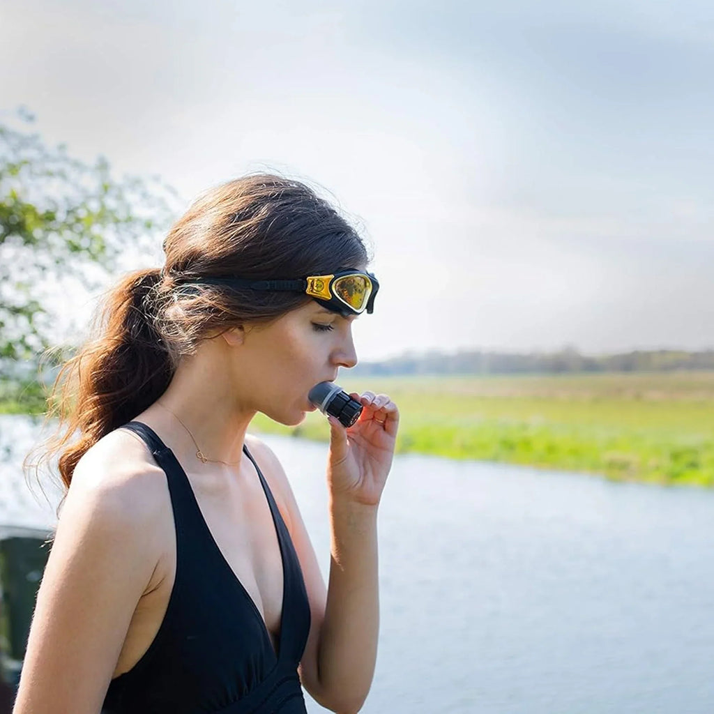 Woman wearing sunglasses with a microphone headset outdoors
