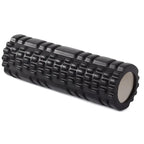 Black foam roller with textured surface on a white background