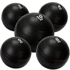 Set of black weighted exercise balls with varying weights on a white background