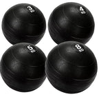 Four black exercise balls with weight markings on a white background