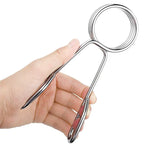 Hand holding a pair of silver scissors against a white background