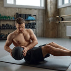 Man exercising with a medicine ball in a gym setting