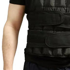 Black weighted vest on a person against a white background