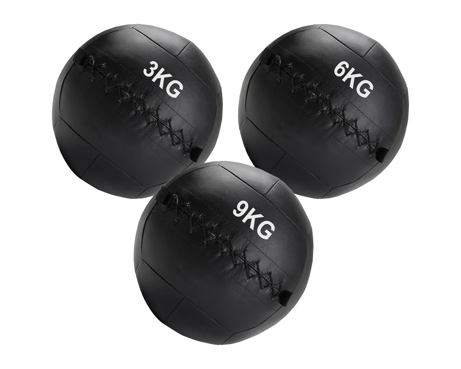Three black weighted medicine balls with different weights on a white background