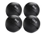 Four black medicine balls with weight markings on a white background