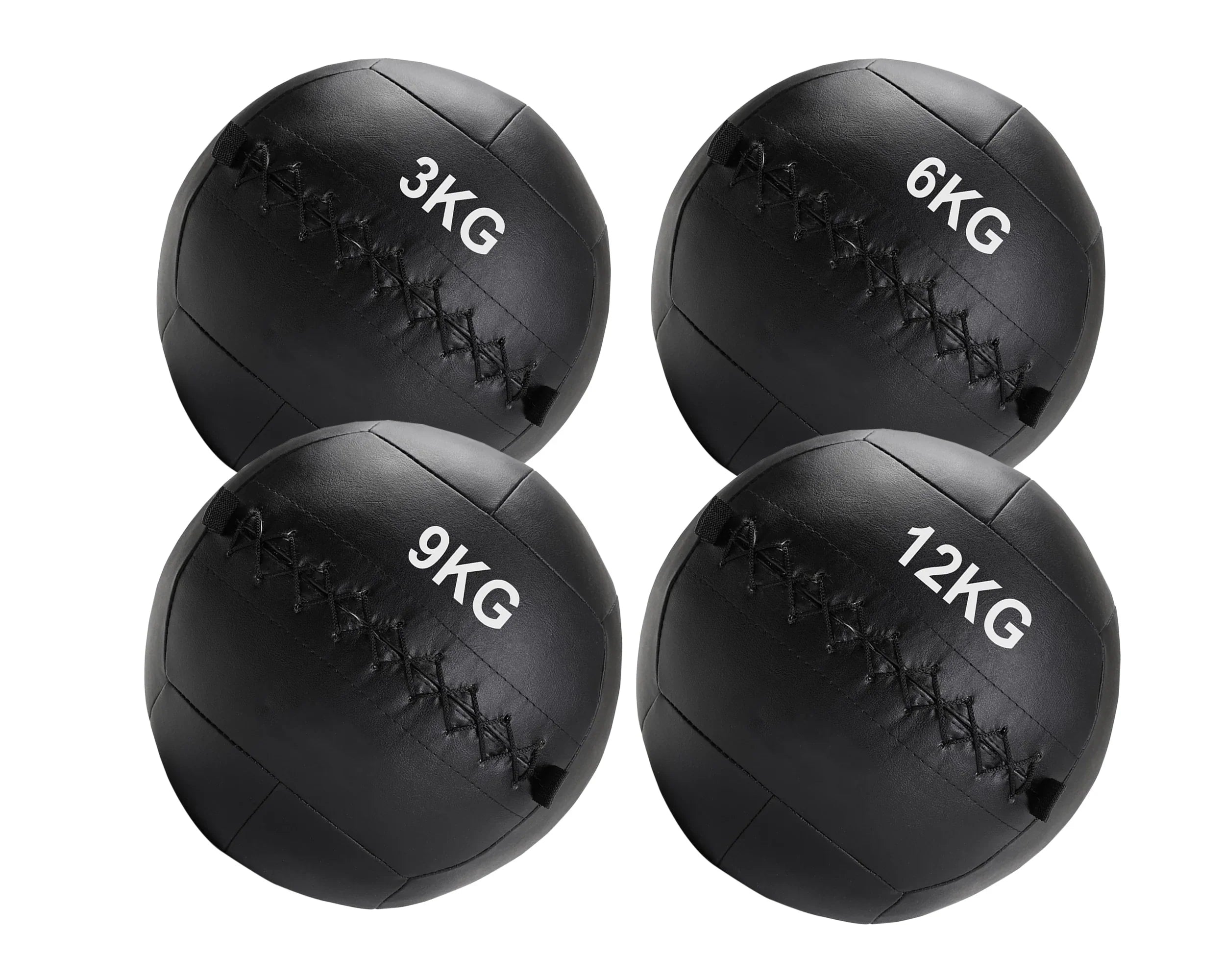 Four black medicine balls with weight markings on a white background