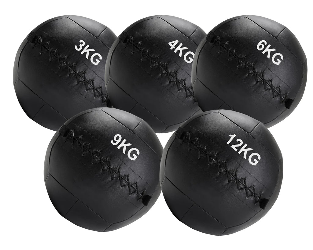 Set of five black weighted medicine balls with labeled weights on a white background
