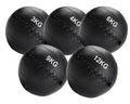 Set of five black weighted medicine balls with labeled weights on a white background