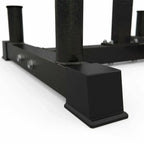 Black metal squat rack on a white background