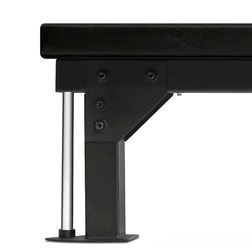 Close-up of a black metal bench with a white background