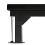 Close-up of a black metal bench with a white background